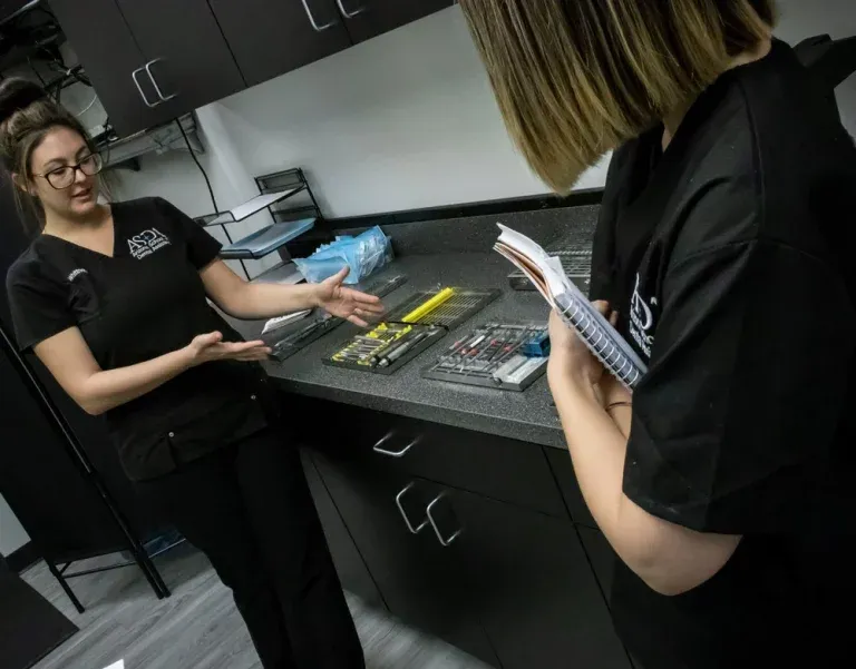 Instructor reviewing materials and requirements with a student